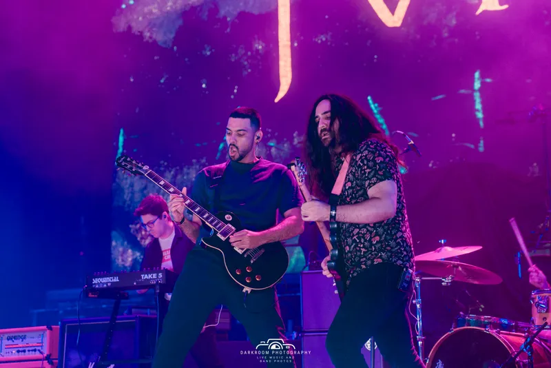 MOTHS band members performing live