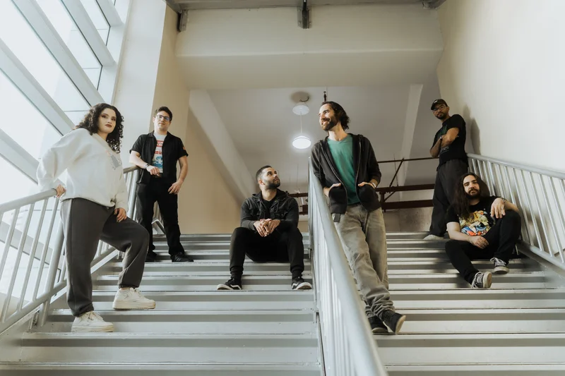 MOTHS band members posed on staircase shot from low angle